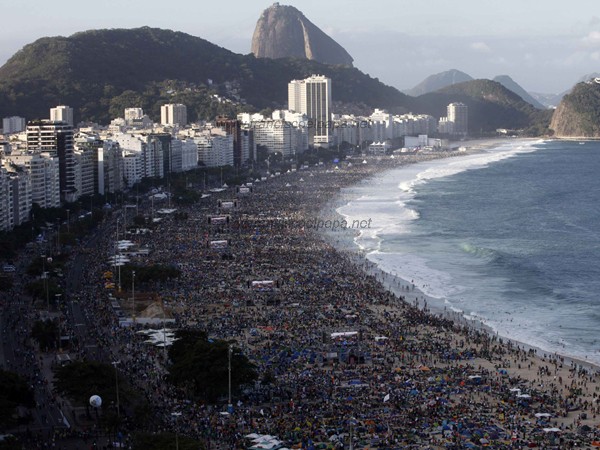 Catholic faithful camp out on Copacabana Beach to participate in an all-night vigil before Pope Francis gives mass to those attending World Youth Day, in Rio de Janeiro