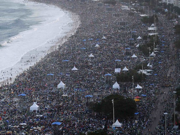 Catholic faithful camp out on Copacabana Beach in Rio de Janeiro